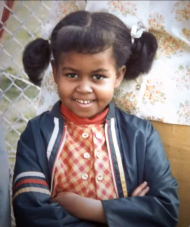 Michelle LaVaughn Robinson rođena je 17. siječnja 1964. u Chicagu. Njezini korijeni sežu daleko u američku prošlost. Preci oba roditelja bili su joj robovi na plantažama u južnom dijelu Amerike te su se nakon oslobođenja preselili u Chicago. Tamo je završila i osnovnu te srednju školu gdje je od malih nogu pokazala iznimne sposobnosti. Michelle je, naime, preskočila drugi razred osnovne škole, a tijekom cijelog školovanja je bila jedna od najuspješnijih učenica generacije. Nakon srednje škole upisala je preddiplomski studij sociologije i afroameričke povijesti, kulture i politike na Sveučilištu Princeton. Na tom je sveučilištu spoznala koliko su studenti afroameričkog podrijetla u znatno nepovoljnijoj poziciji od onih iz bjelačkih obitelji. Upravo zato je teza njezinog završnog rada bila pozicija afroameričkih studenata na istom sveučilištu. To su bili korijeni njezina kasnijeg aktivizma, koji ju do danas nije napustio. 