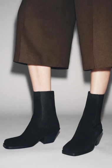 Elegantne i praktične: Crne čizmice s udobnim potpeticama za dnevne kombinacije